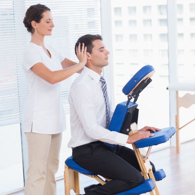 Business man having head massage in office